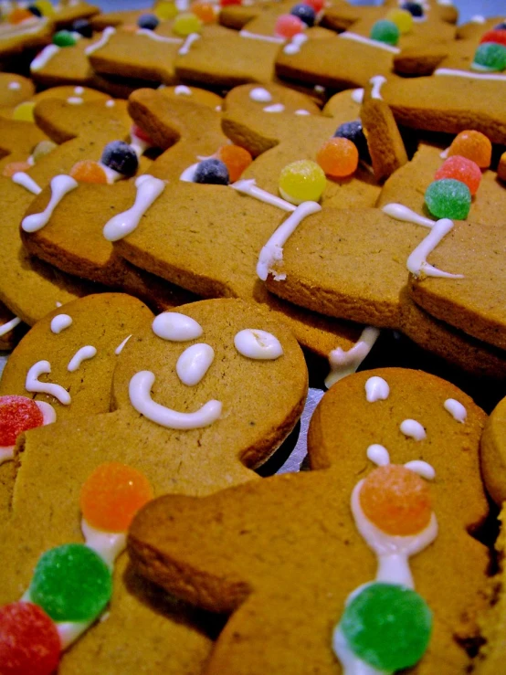 an assortment of gingerbreads with gummy bears on them