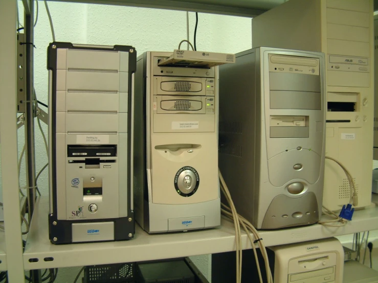 a group of computer monitors and peripheral equipment