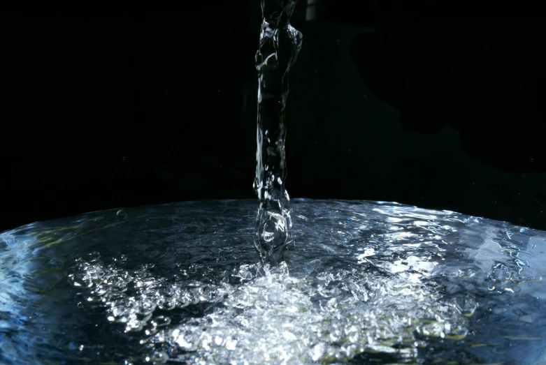 a round water spout with water coming from it