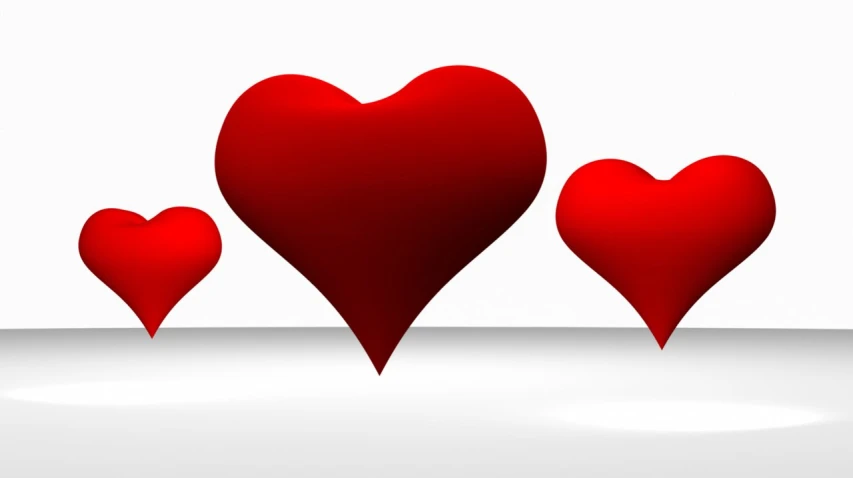 three hearts standing at each other with a white background