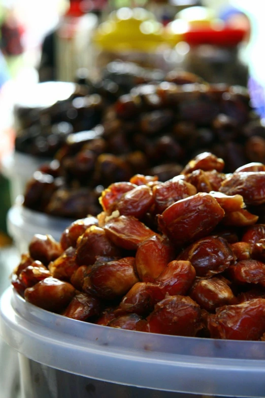 the table is covered with lots of different kinds of olives