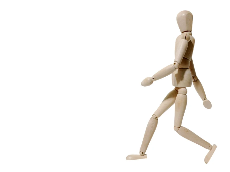 a wooden doll running and wearing a headband