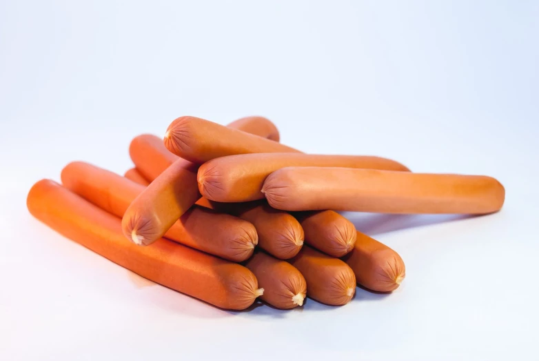 a group of orange carrots in the shape of long arms