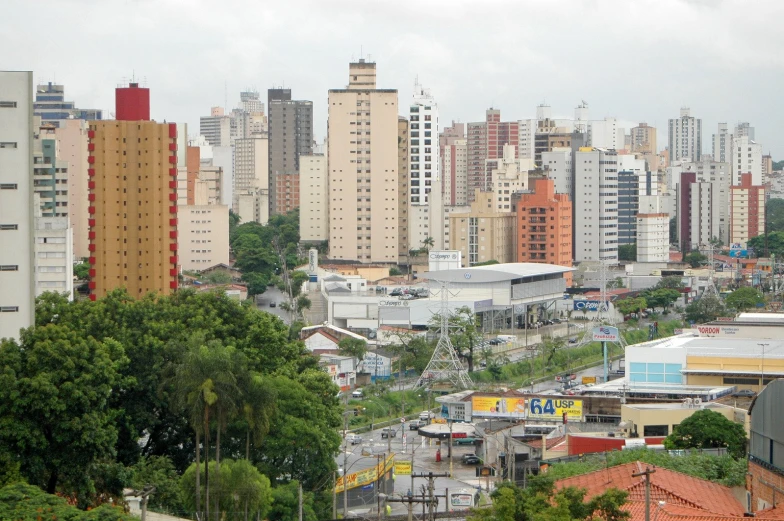 the cityscape shows tall buildings and trees