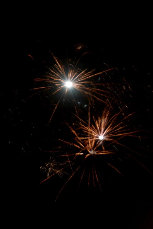 a couple of fireworks are coming out of a firework