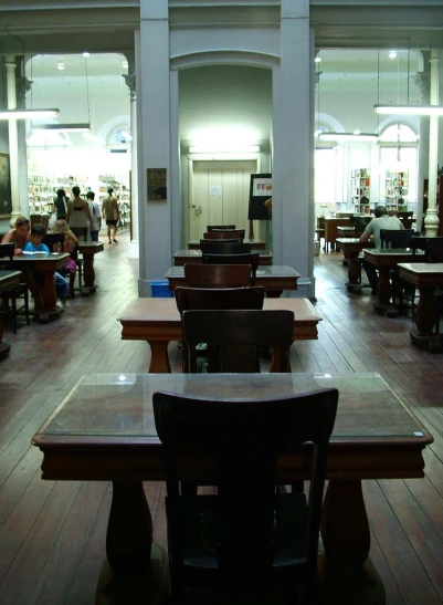 many tables with seats in a classroom setting