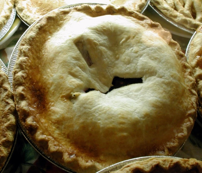 a big stack of pies sitting next to each other