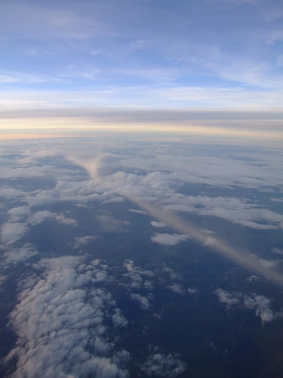 the wing of an airplane above the clouds