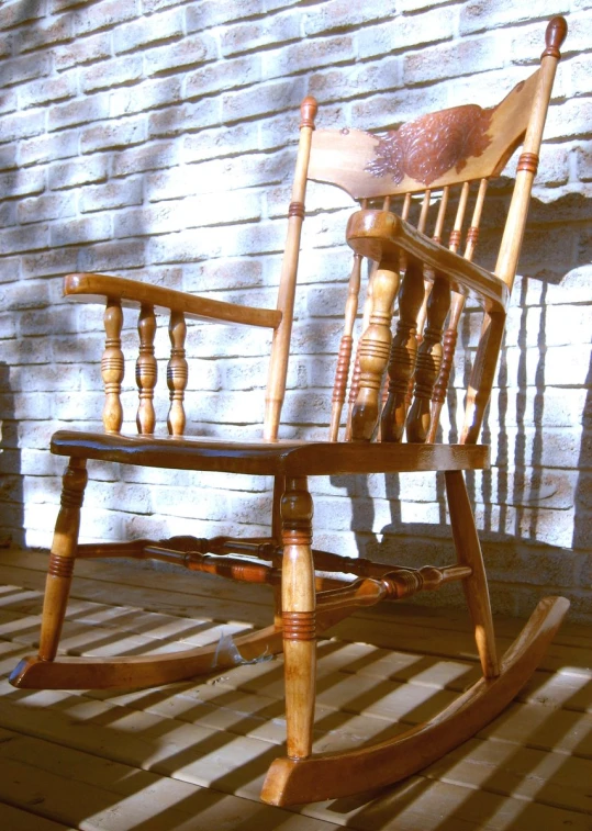 an old rocking chair is sitting in the sun