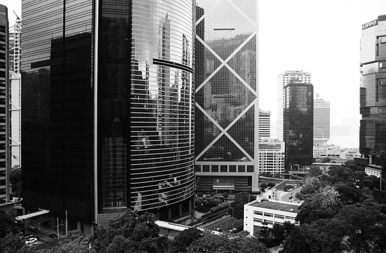 a city with tall buildings and skyscrs, in a black and white po