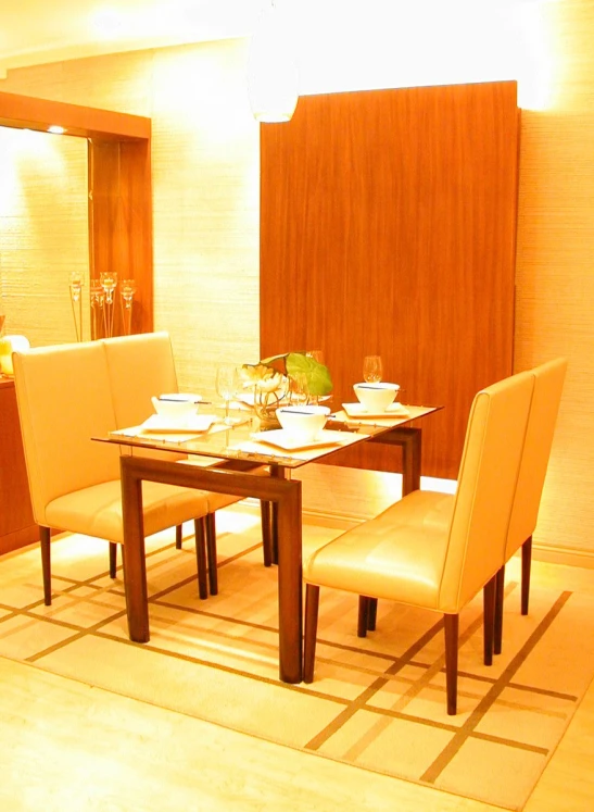 the room has a brown table with chairs and two white dining chairs