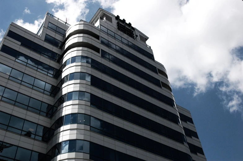 this building has very high windows and a clock on top