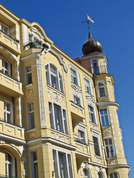 the front of an old building with an oriental decoration on its side