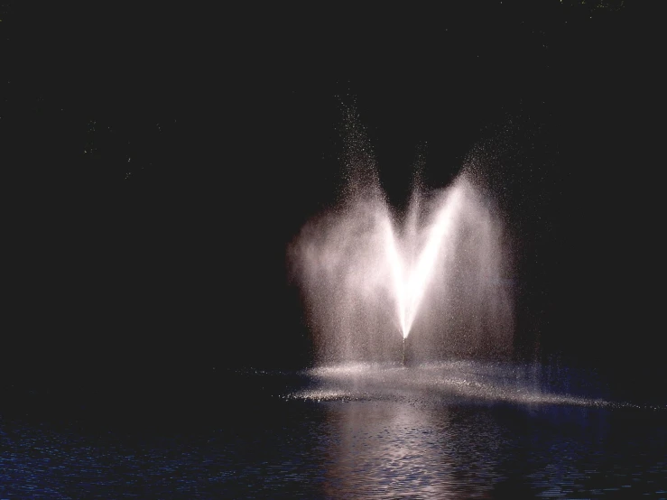 two water fountains are spewing into the air