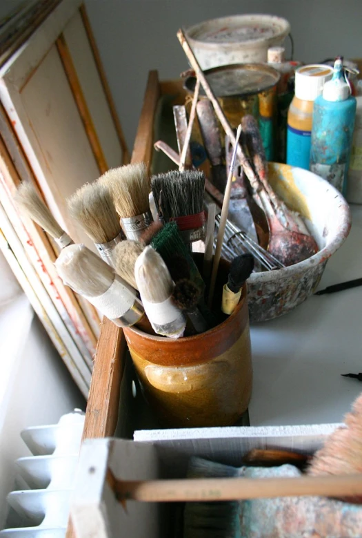 the brushes are next to other household objects