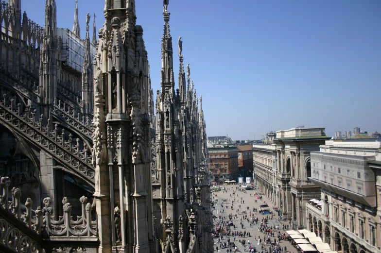 an aerial view of a city square with gothic style architecture