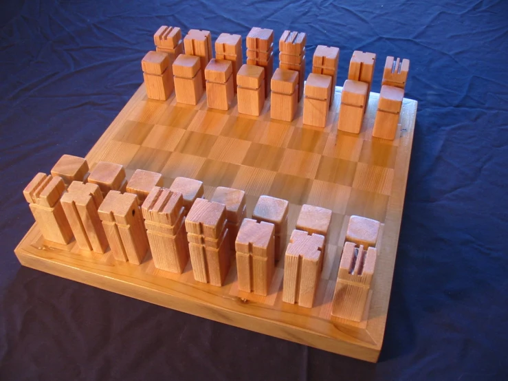 a chess board has been made out of wooden blocks