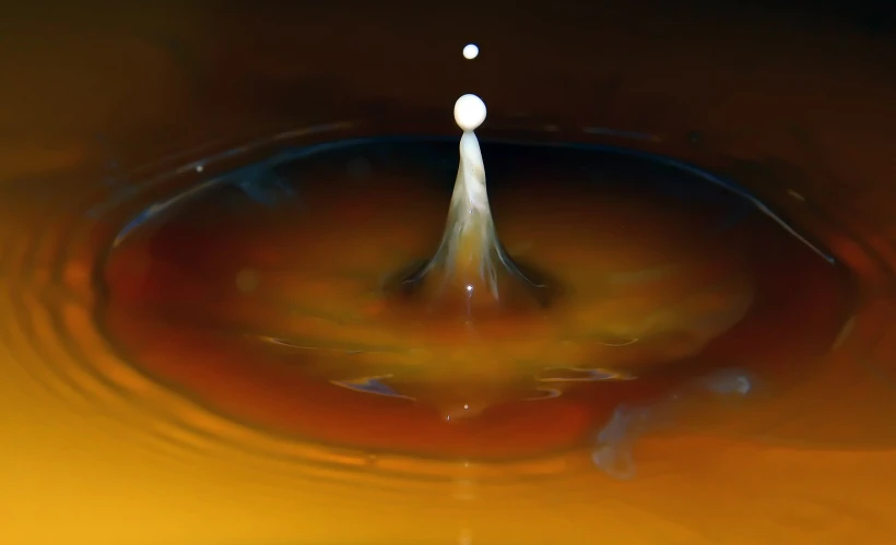 a po of a water drop in a sink with bubbles