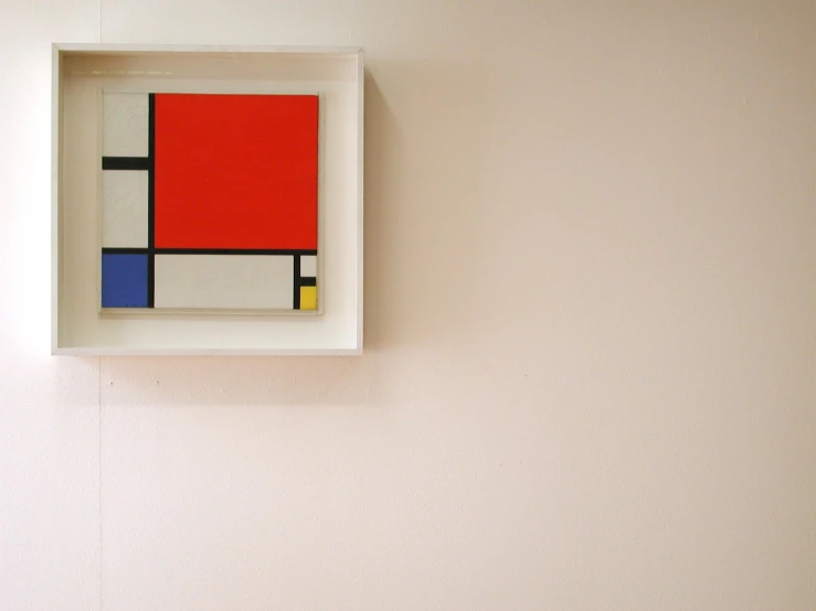 a white frame holds a painting that is square