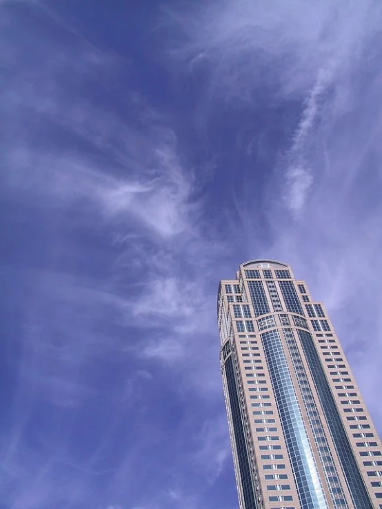 view from the ground looking up at a skyscr building