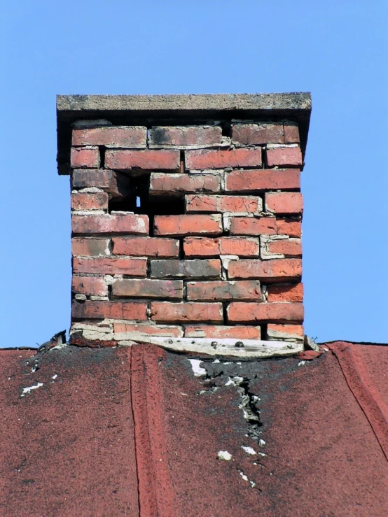 brick chimney with a partially closed brick block