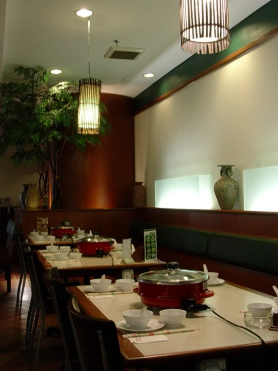 the empty dining room has no people and two dishes