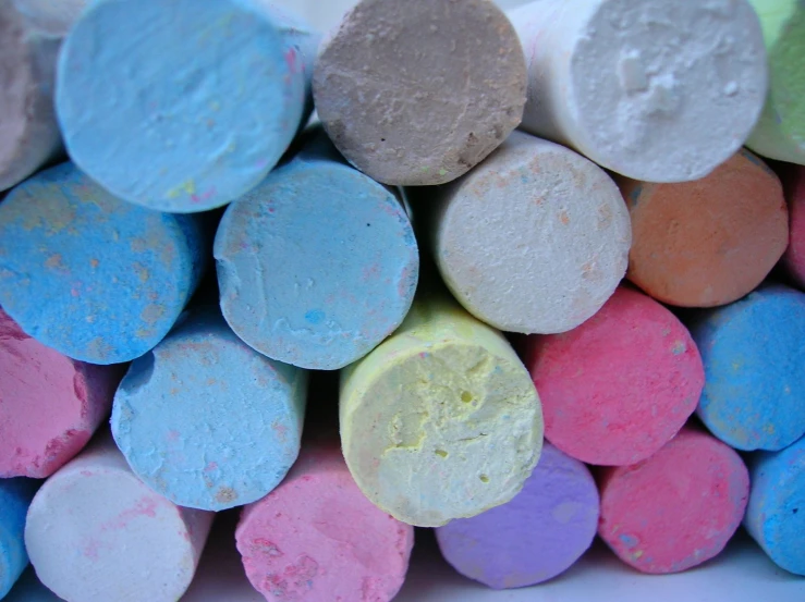 colorful chalk sticks stacked neatly in a large pile