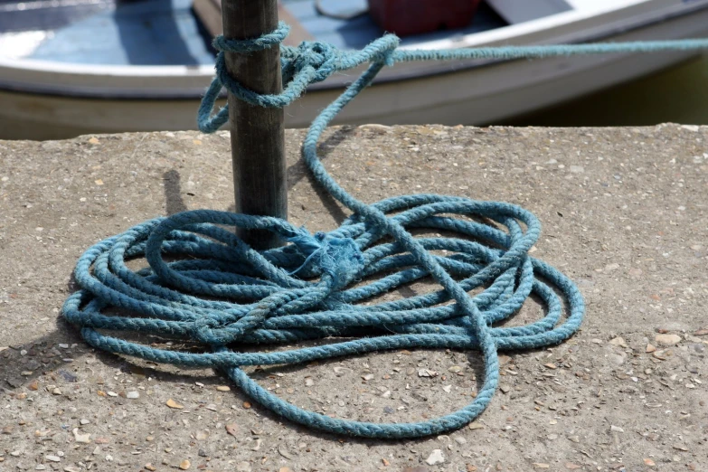 the rope has caught the boat in the dock