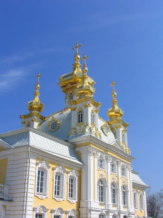 a fancy white and gold building with steeples