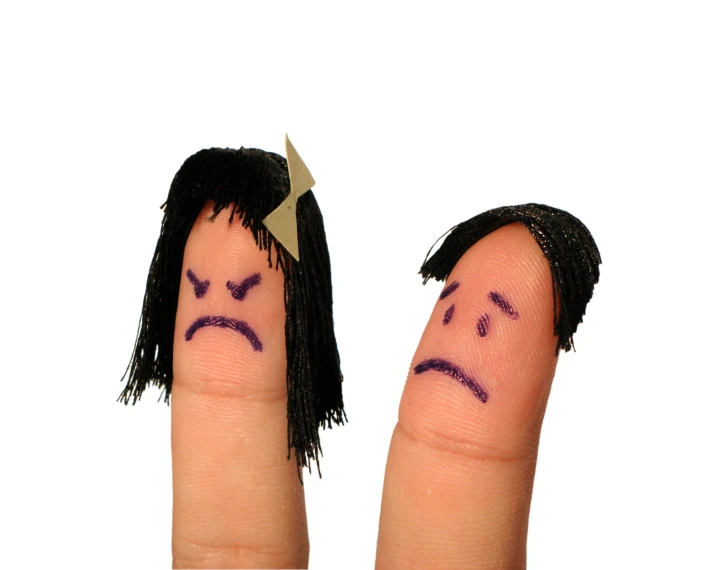 a couple of fingers with faces drawn on them