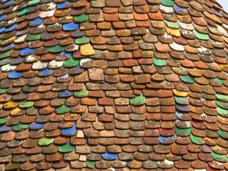 a colorful roof made up of multiple types of tiles