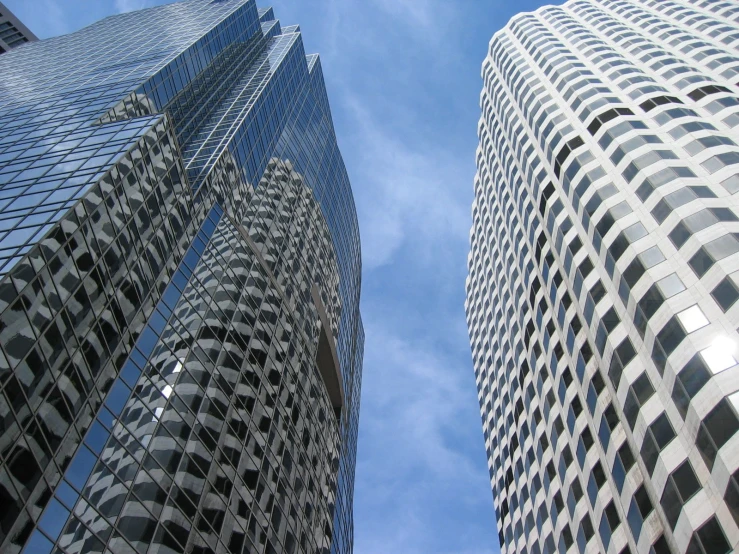 the building in the foreground is mostly glass