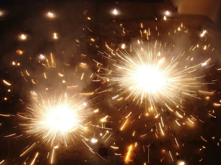 a cluster of fireworks in a large open night sky