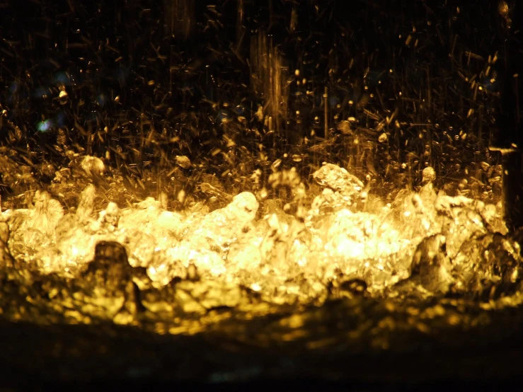 a lot of yellow liquid coming out of some kind of fire