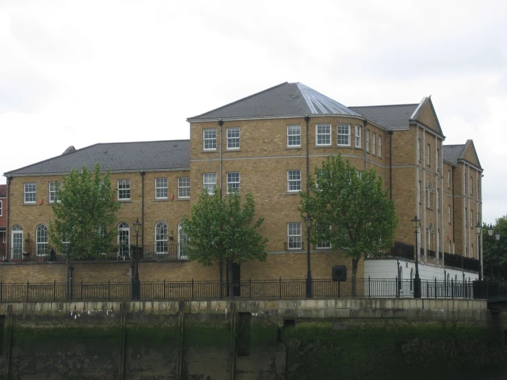 a large building with some trees next to it