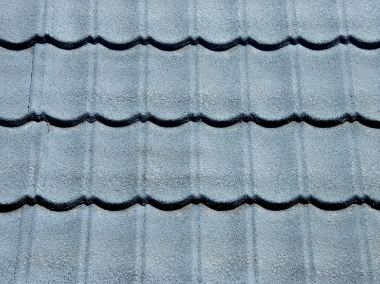 a blue roof with curved shapes and black spots