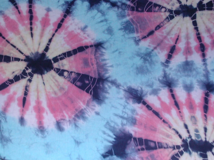 the pink and blue tie - dye pattern is visible