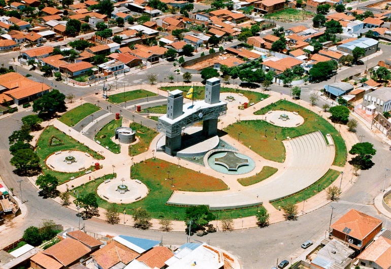 an aerial view of a small town with a clock tower