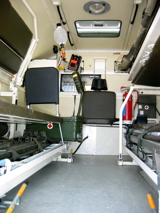 inside of the bus's main compartment, there is a ladder leading to each seat