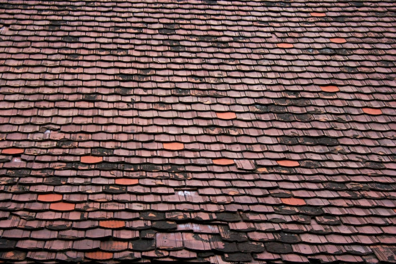 the roof is broken into pieces in a pile