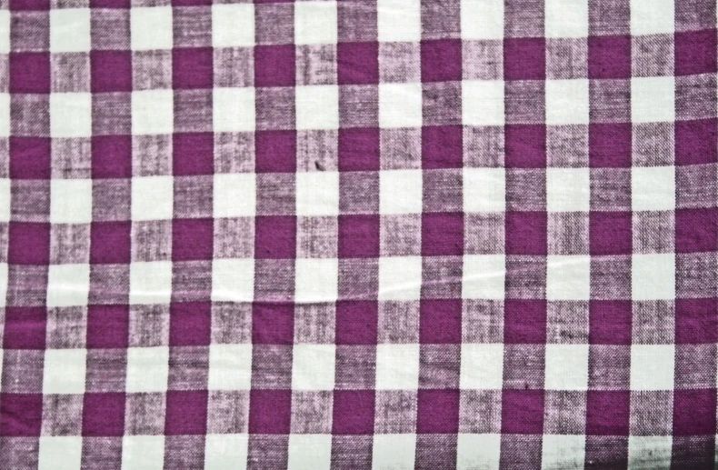 a purple and white checkered pattern on fabric