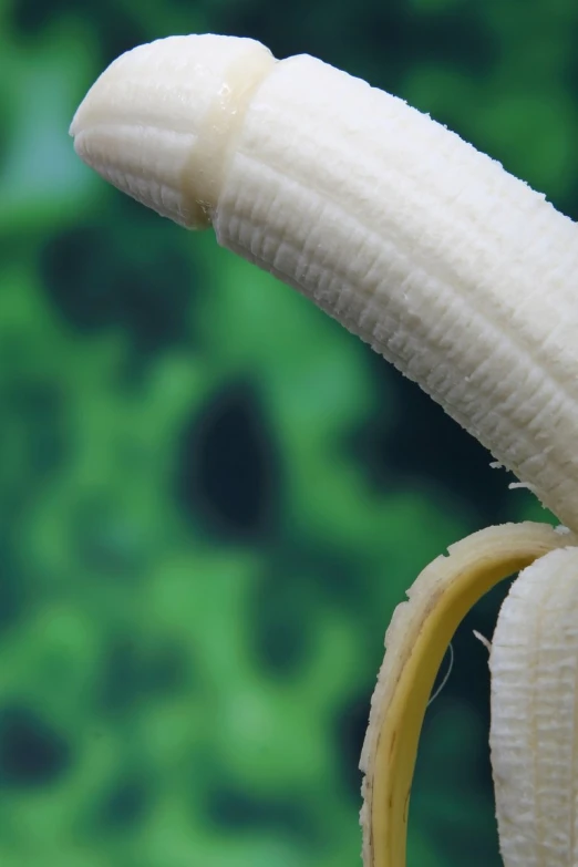 a banana is shown in front of a blurred background