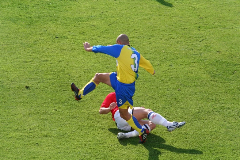 two soccer players on the field during a game