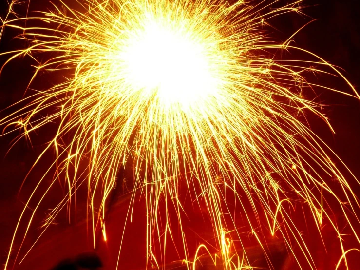 a group of people are watching the fireworks