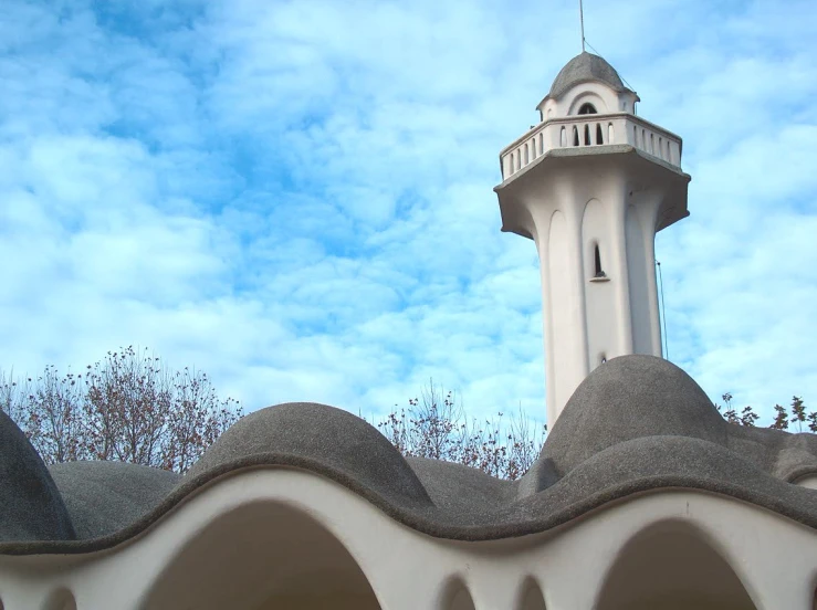 the sky is blue and white above the building