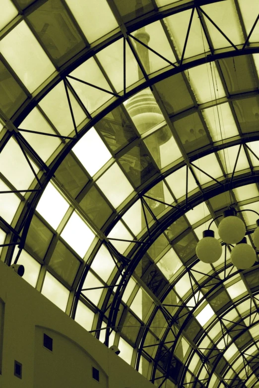 an interior s looking up to the ceiling and a round glass