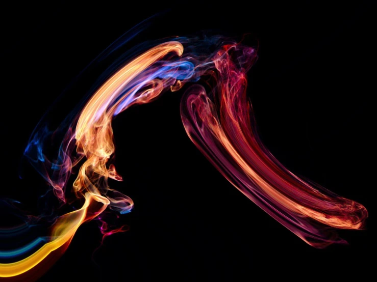 multiple colorful fire swirls against a black background