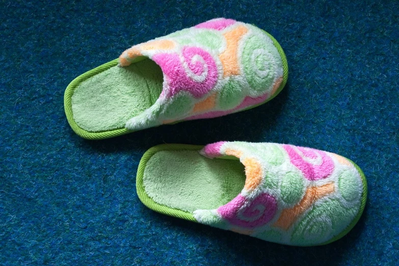 a pair of shoes with colorful flowers on them