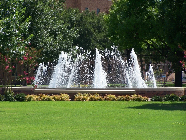 a water fountain in front of an office building
