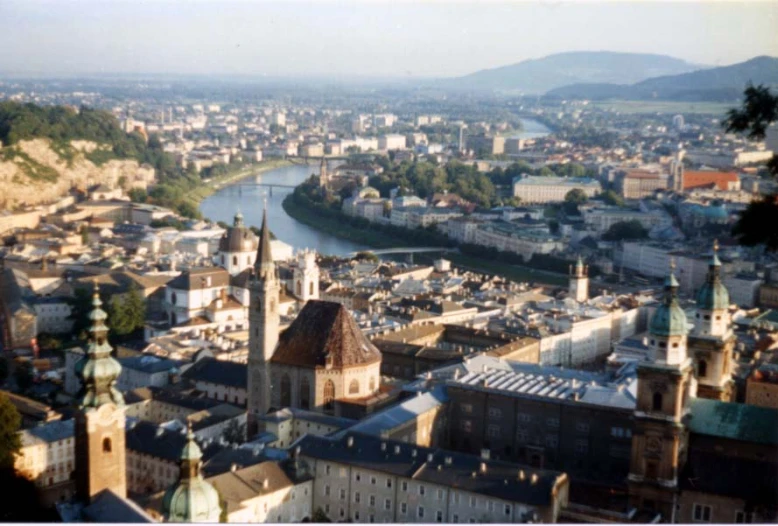 the view of a city with steeple roofs